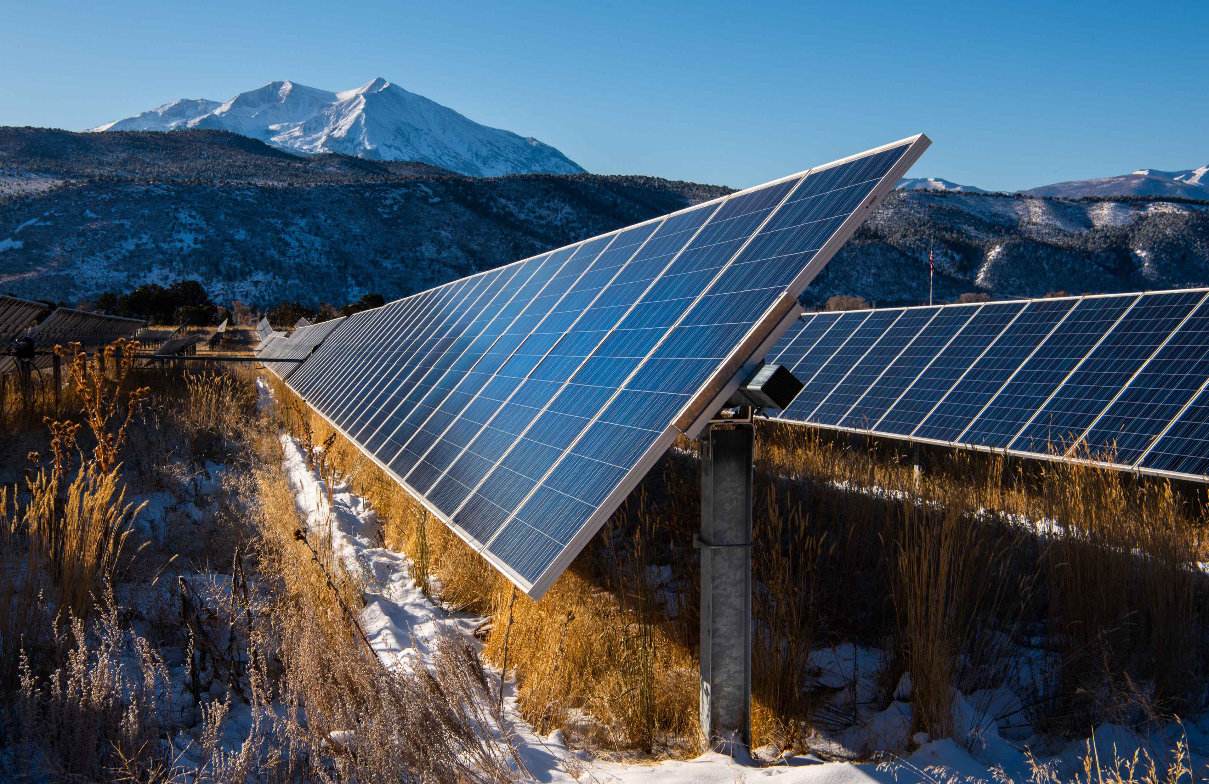 April 24, 2021 - Solar panels set before a mountain range (Photo by Werner Slocum / NREL)